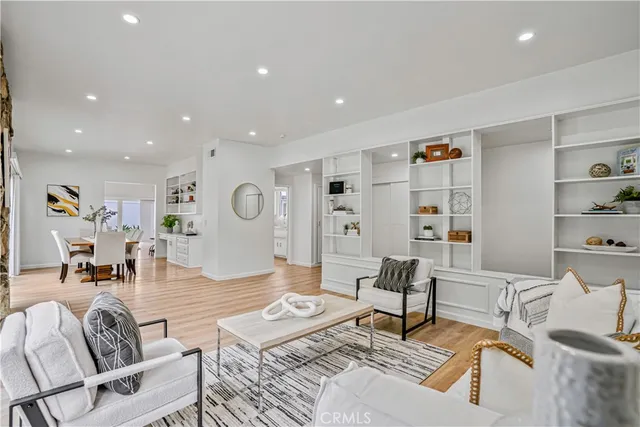 a living room with furniture or couch and a bookshelf