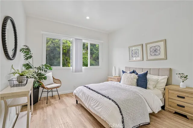 a bedroom with a bed and a chair