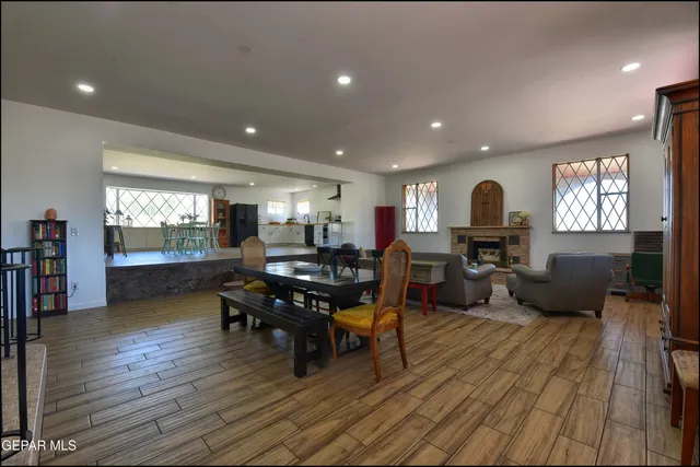 a living room with furniture window and wooden floor