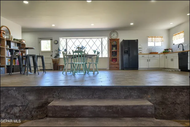 a view of a dining room with furniture and chandelier