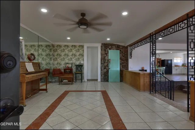 an open kitchen with a table and chairs