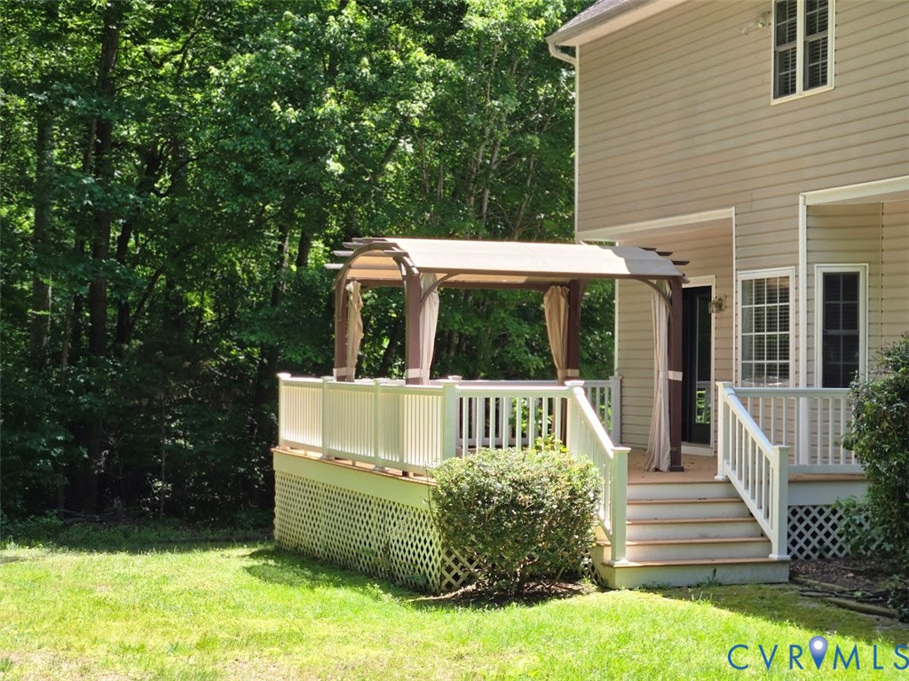 16406 Benmore Road Moseley, VA 23120 - Photo 30 of 32 a view of a chair and table on the deck