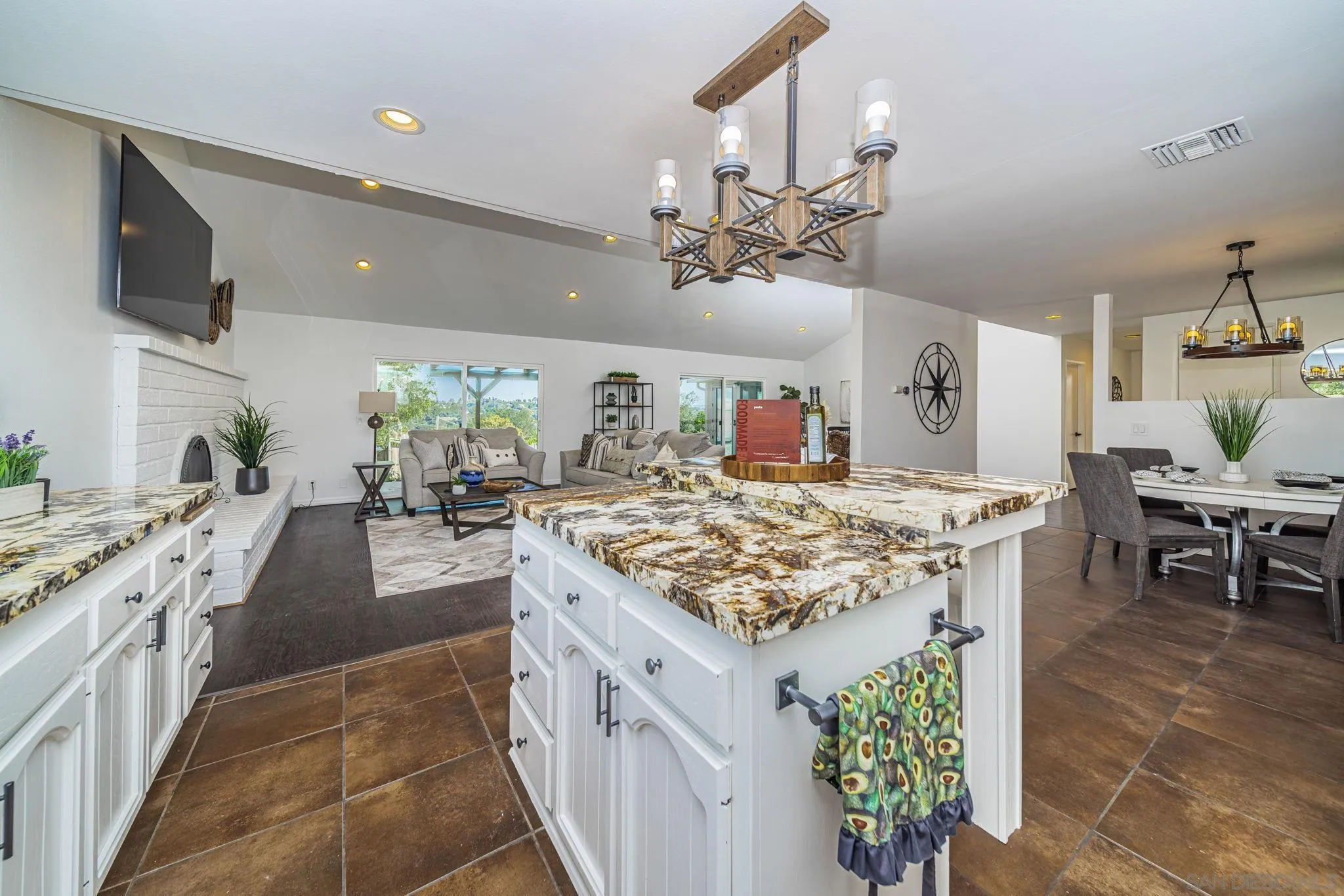 1396 Friends Way Fallbrook, CA 92028 - Photo 14 of 52 a kitchen with kitchen island granite countertop lots of counter top space