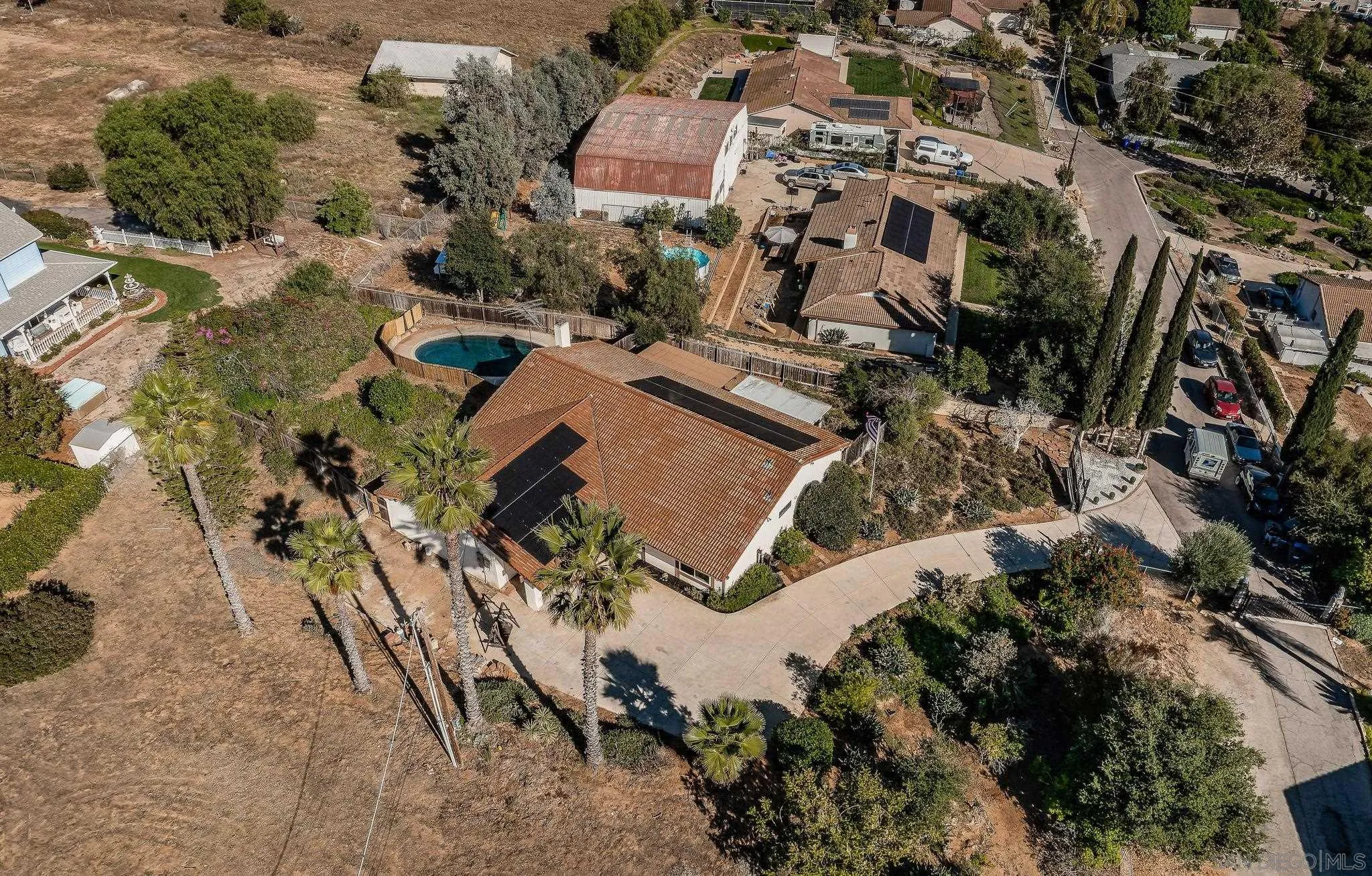 1396 Friends Way Fallbrook, CA 92028 - Photo 6 of 52 an aerial view of multiple houses with yard