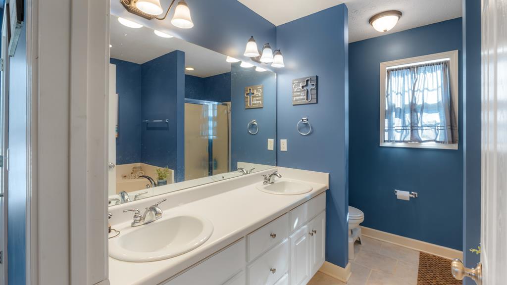 165 Firetower Road Buena Vista, GA 31803 - Photo 15 of 30 a bathroom with a sink double vanity and a mirror