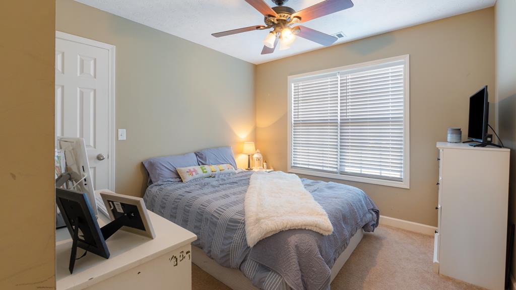 165 Firetower Road Buena Vista, GA 31803 - Photo 17 of 30 a bedroom with a bed and a window