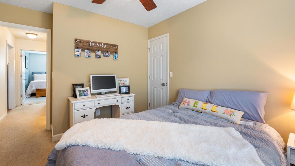 165 Firetower Road Buena Vista, GA 31803 - Photo 18 of 30 a bedroom with a bed and a flat screen tv