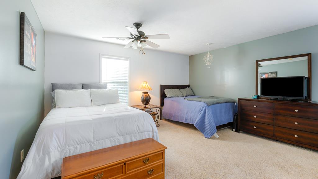 165 Firetower Road Buena Vista, GA 31803 - Photo 20 of 30 a bedroom with a bed and a flat screen tv