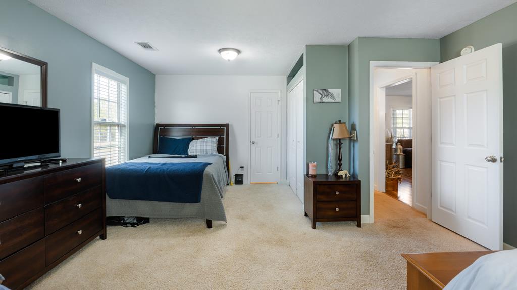 165 Firetower Road Buena Vista, GA 31803 - Photo 21 of 30 a bedroom with furniture and a flat screen tv