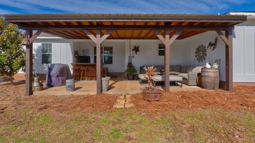 165 Firetower Road Buena Vista, GA 31803 - Photo 26 of 30 a view of a chairs and table in a patio