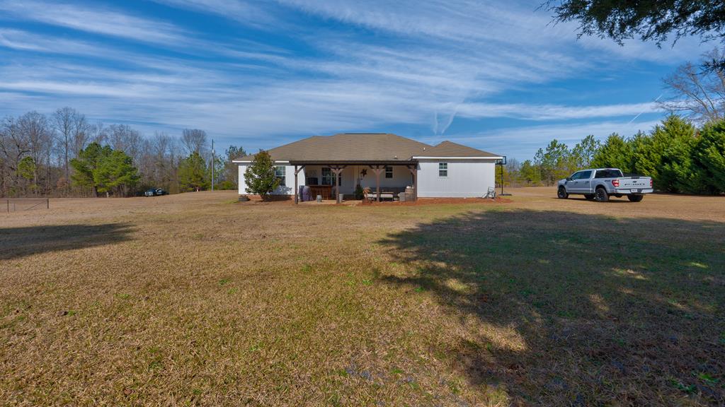 165 Firetower Road Buena Vista, GA 31803 - Photo 27 of 30 a front view of a house with a yard and garage