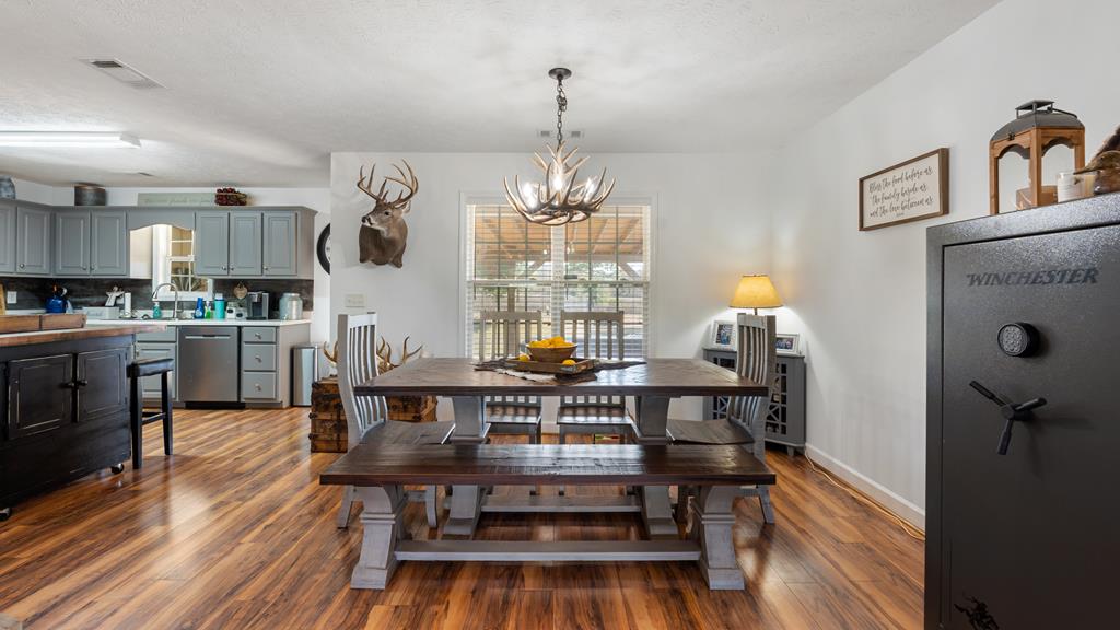 165 Firetower Road Buena Vista, GA 31803 - Photo 7 of 30 a view of a dining room with furniture window and wooden floor