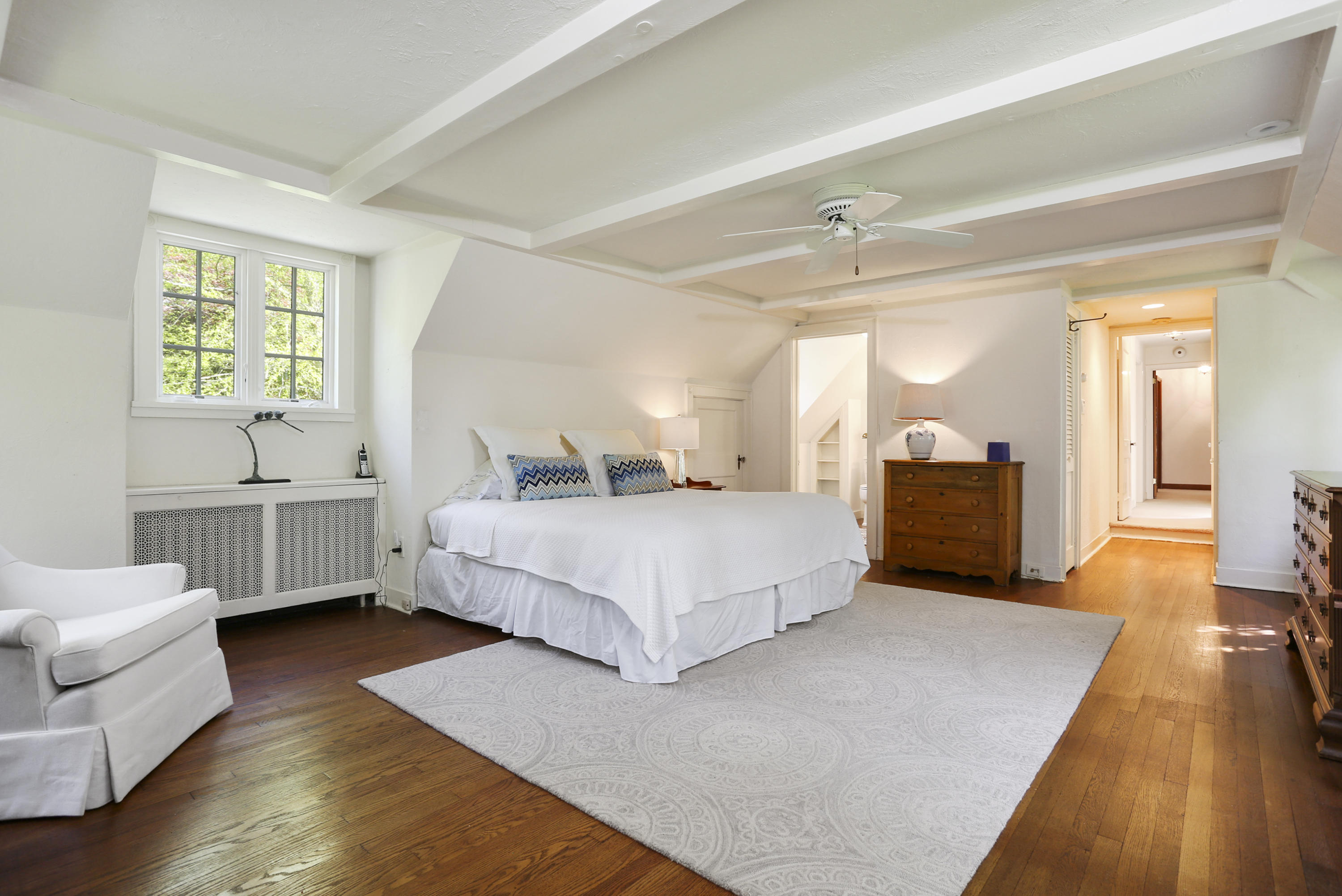 5 Meadowbrook Road Darien, CT 06820 - Photo 22 of 40 a bedroom with a bed and a large window