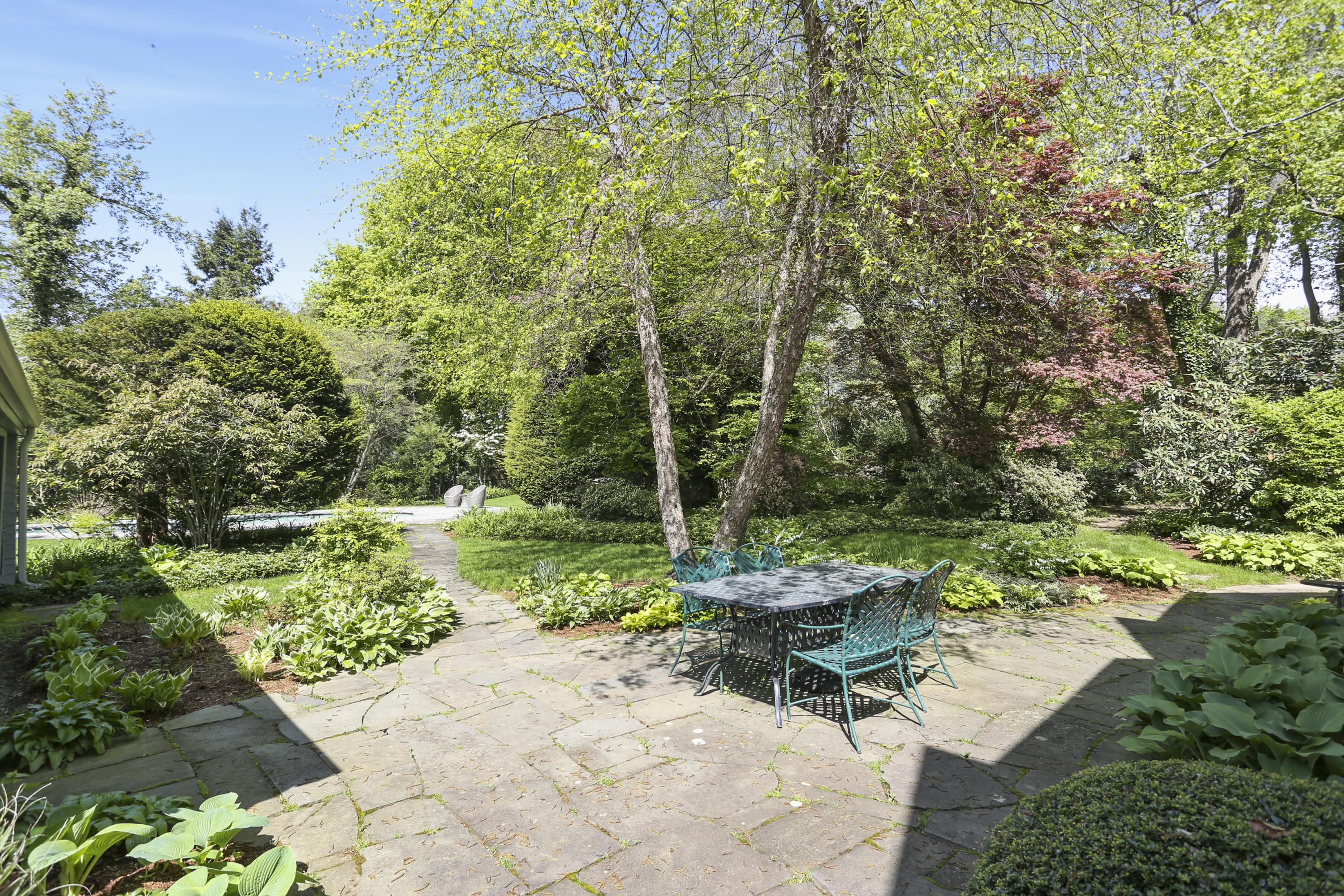 5 Meadowbrook Road Darien, CT 06820 - Photo 34 of 40 a view of a backyard with sitting area