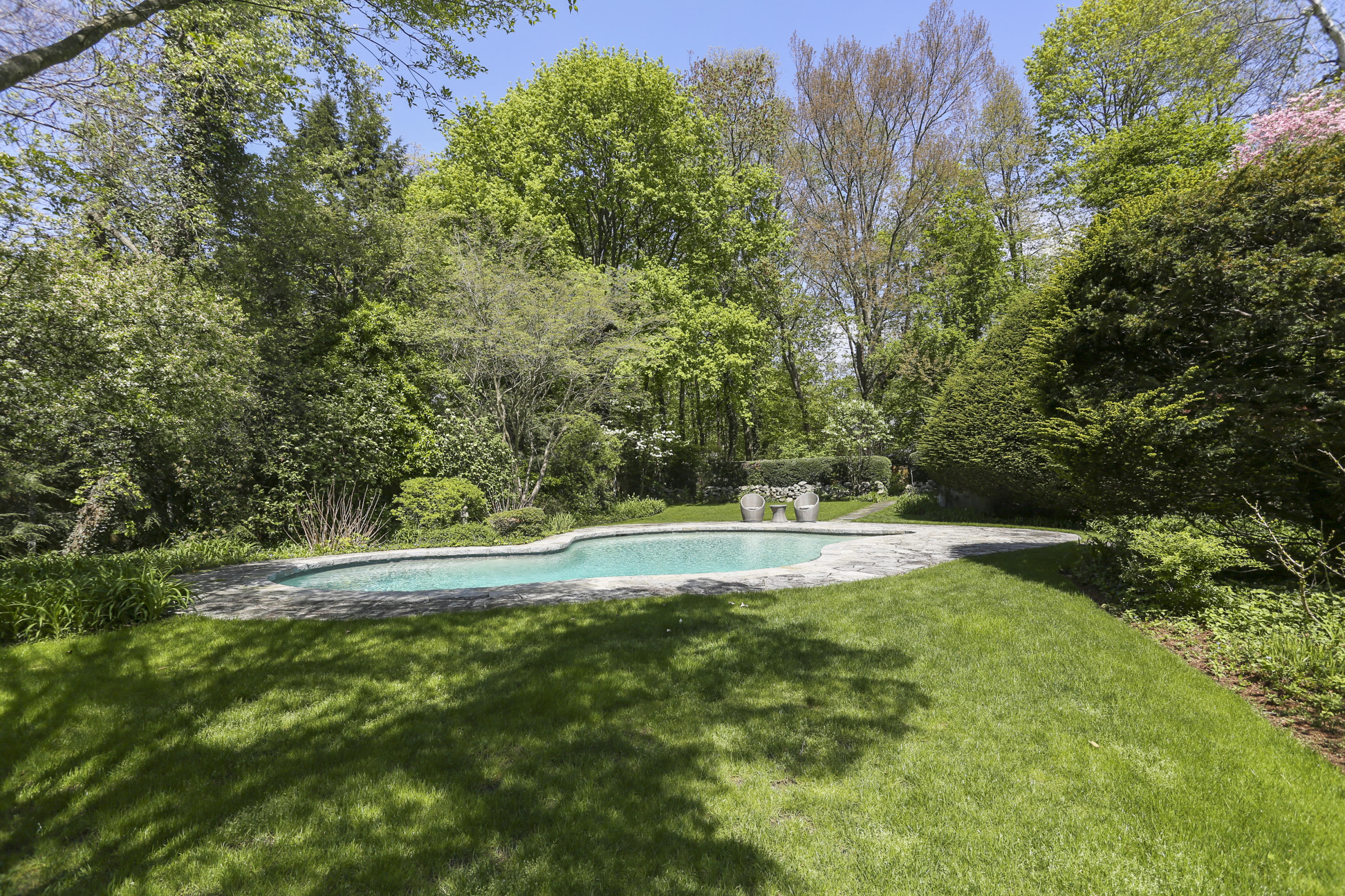5 Meadowbrook Road Darien, CT 06820 - Photo 37 of 40 a view of yard with swimming pool and trees in the background