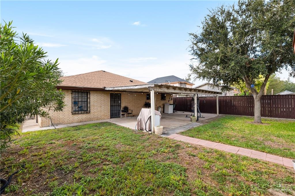 118 J R Becerra Avenue Progreso, TX 78596 - Photo 14 of 17 a front view of a house with garden and porch