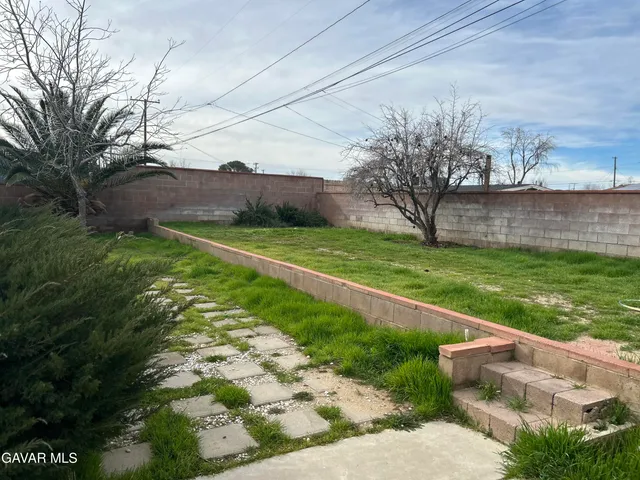 a view of a backyard with a garden