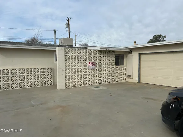a view of a street with garage