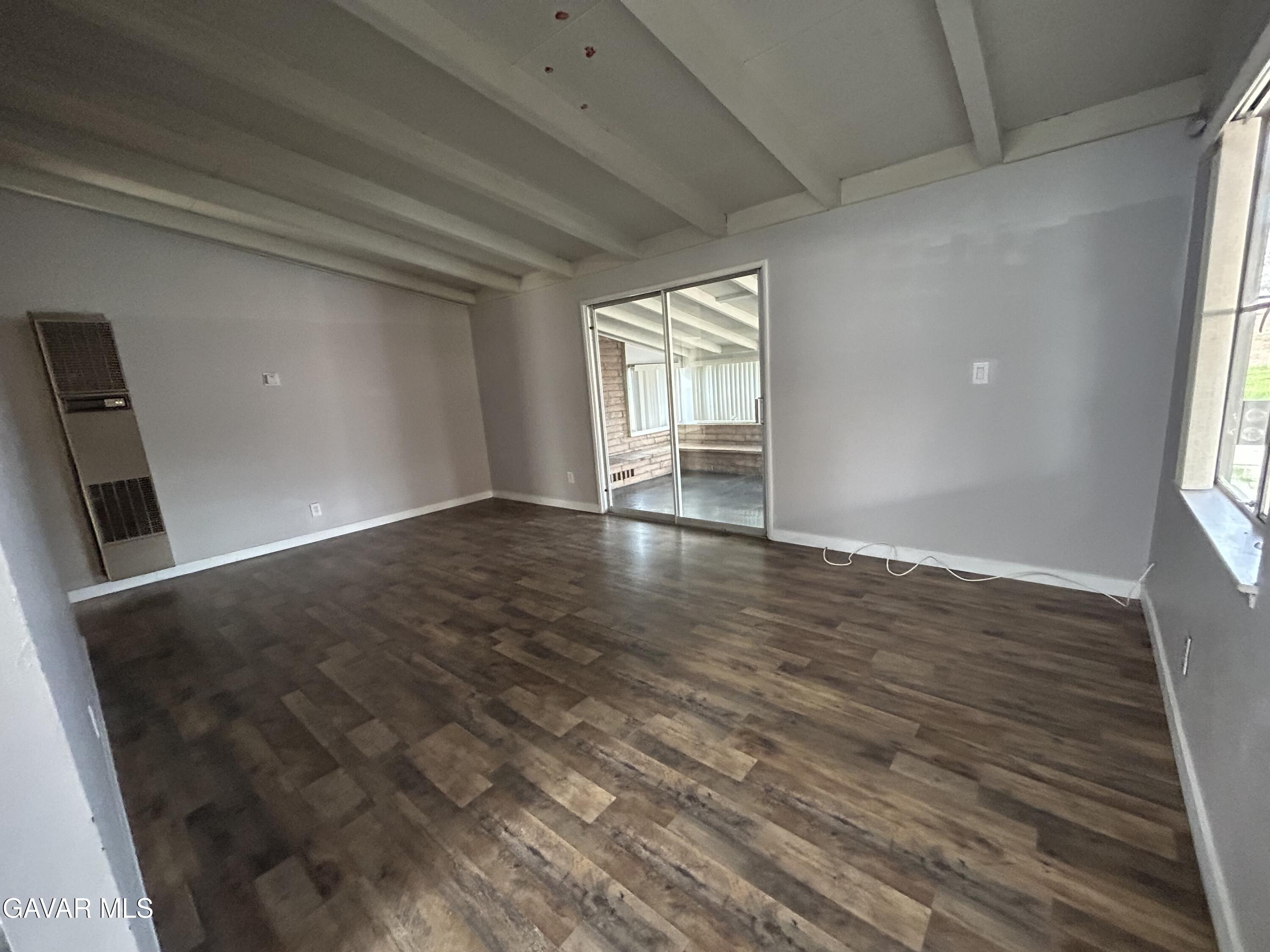 44021 3rd Street East Lancaster, CA 93535 - Photo 4 of 16 wooden floor in an empty room with a window