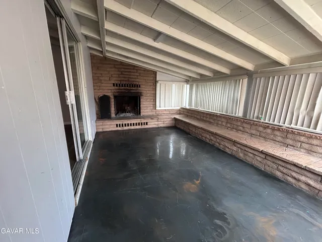 a view of an empty room with stairs