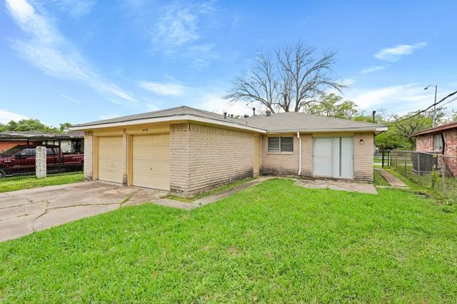 a view of a backyard with a garden