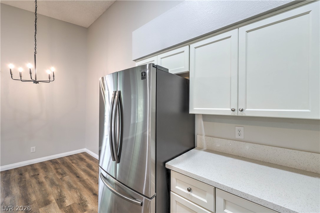 1575 West Warm Springs Road, Unit 322 Henderson, NV 89014 - Photo 13 of 25 This modern kitchen features sleek countertops and contemporary appliances, perfect for culinary enthusiasts.