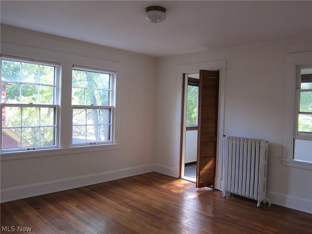 1808 Radnor Road Cleveland, OH 44118 - Photo 15 of 24 Third Bedroom with hardwood floor. Lots of light and opens to Sunroom.