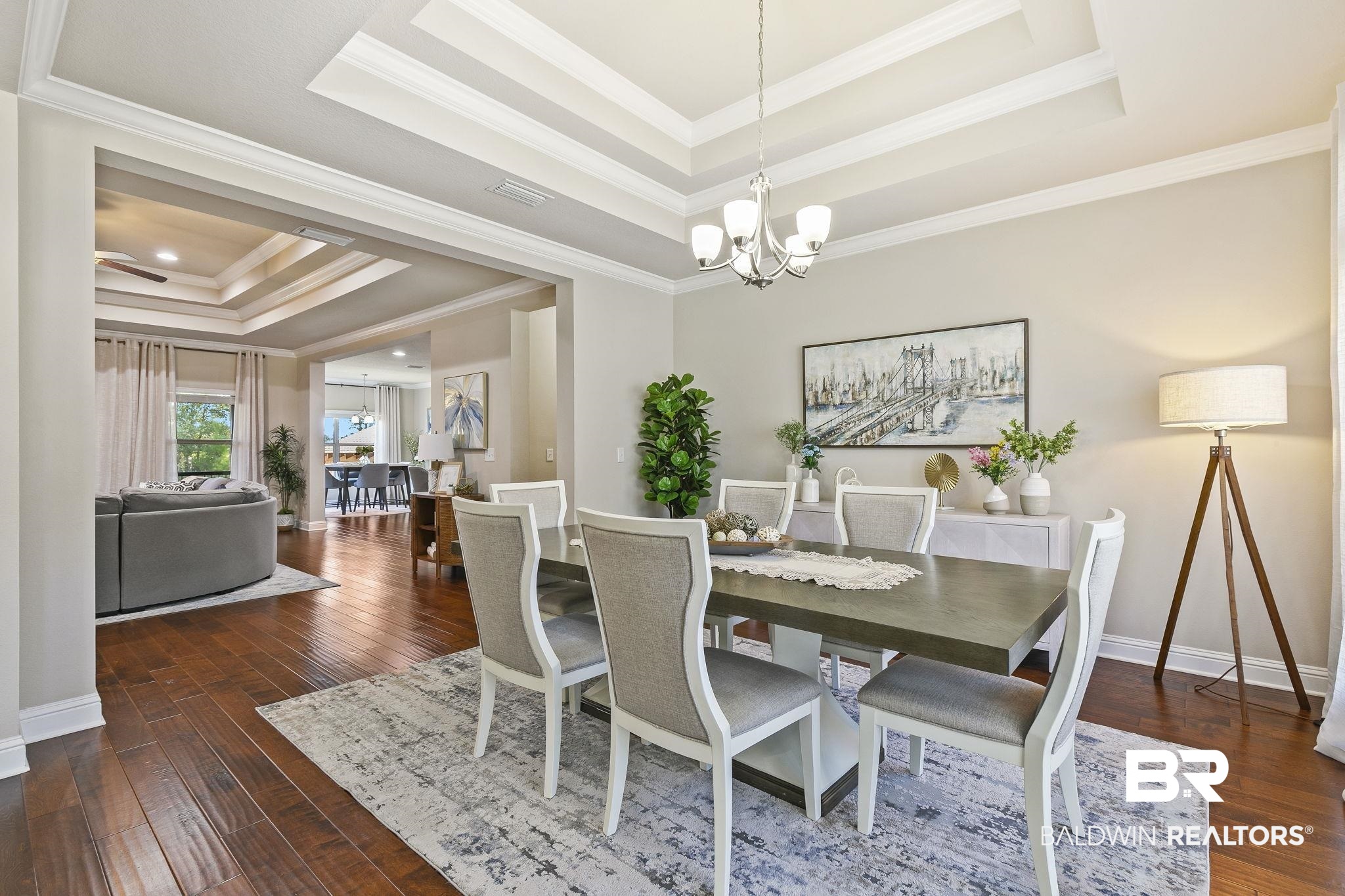 31500 Spoonbill Road Daphne, AL 36527 - Photo 15 of 85 Dining room with ornamental molding, dark hardwood / wood-style flooring, a notable chandelier, and a raised ceiling