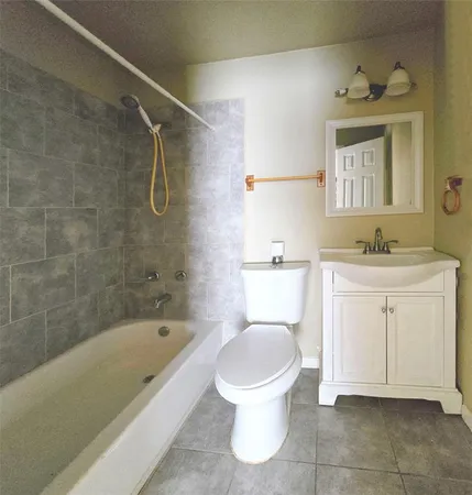 a bathroom with a sink a toilet and a bathtub