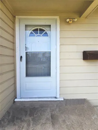 a view of entrance gate of a house