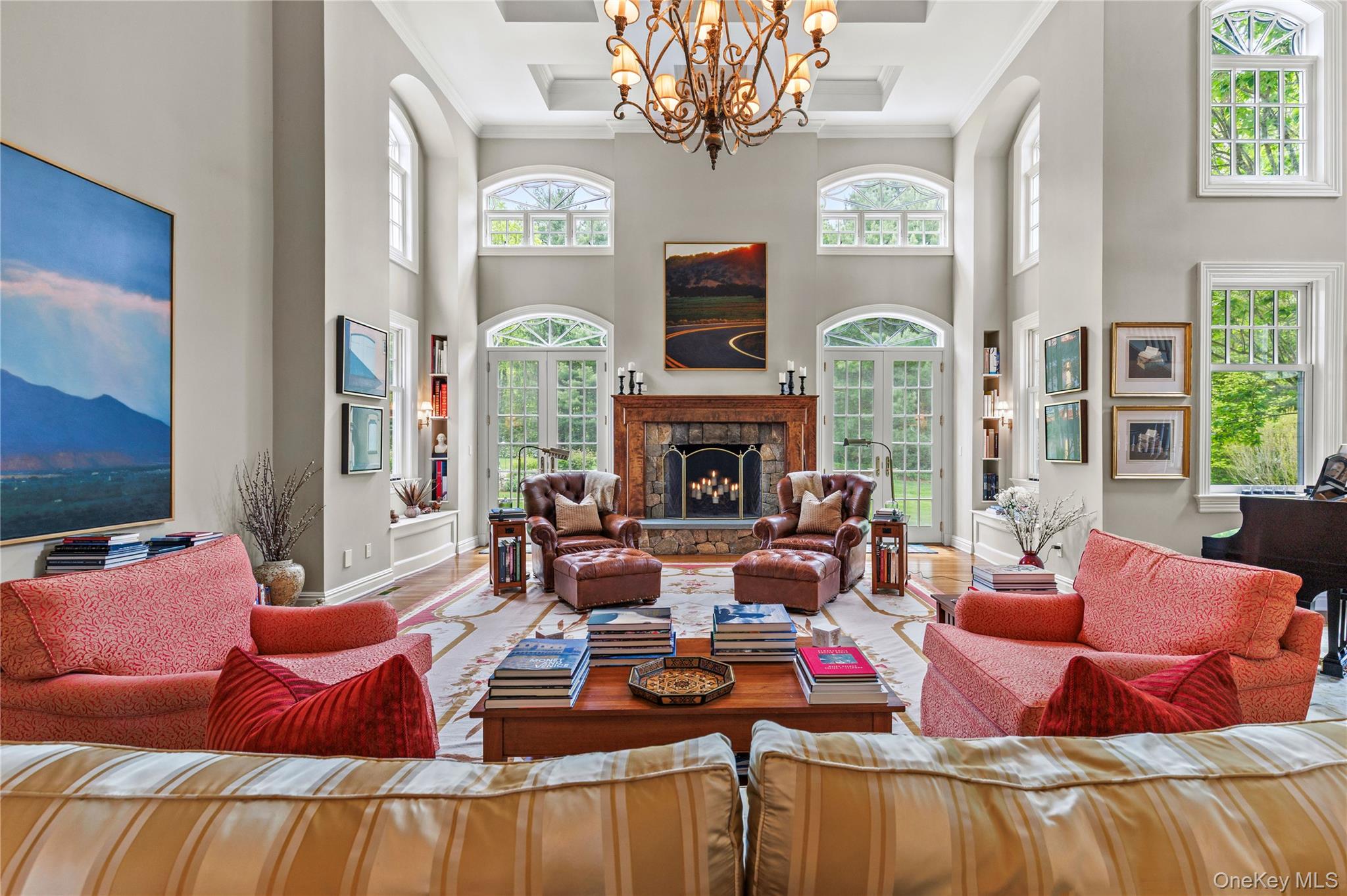 63 Old Mill River Road Pound Ridge, NY 10576 - Photo 14 of 47 a living room with furniture chandelier and a large window