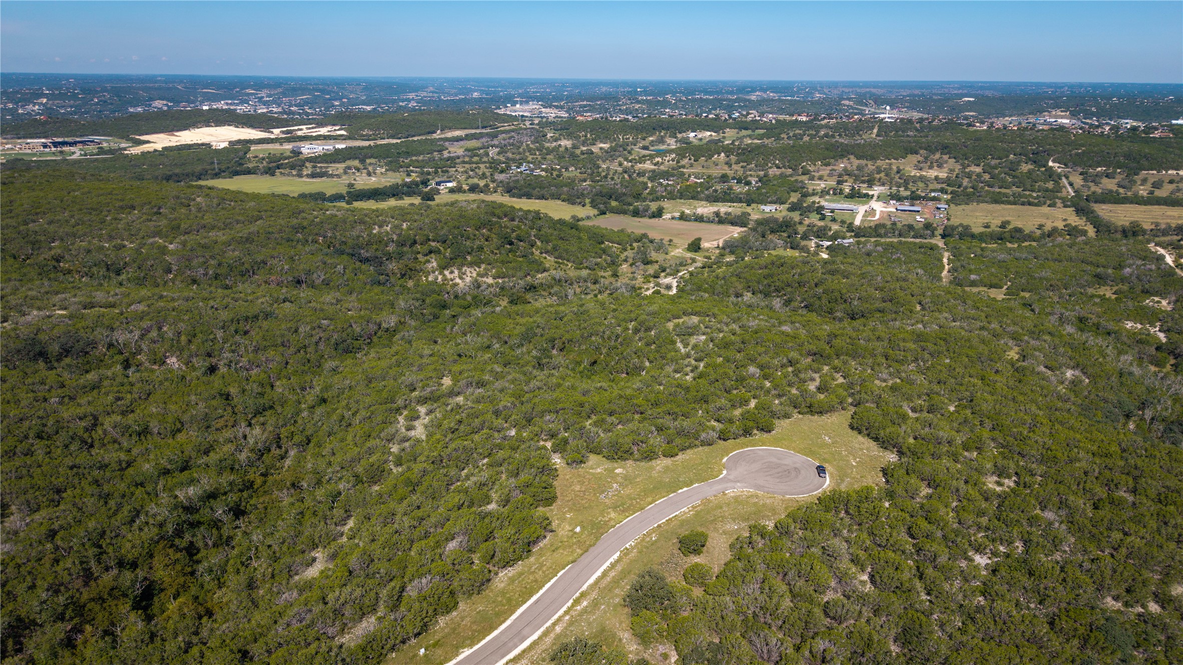 150 Henderson Branch Road West Ingram, TX 78025 - Photo 25 of 35 a view of a lake with a city