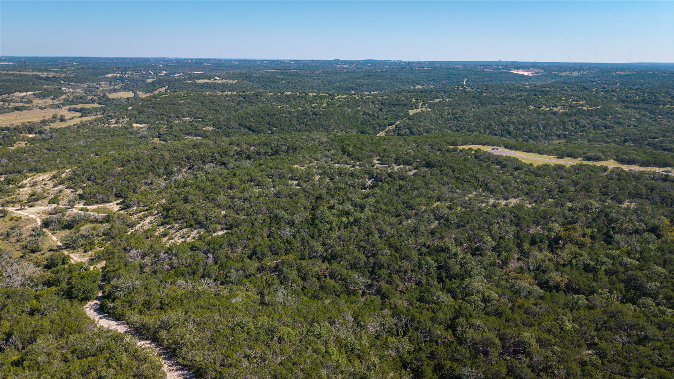 150 Henderson Branch Road West Ingram, TX 78025 - Photo 31 of 35 an aerial view of residential houses with outdoor space and trees