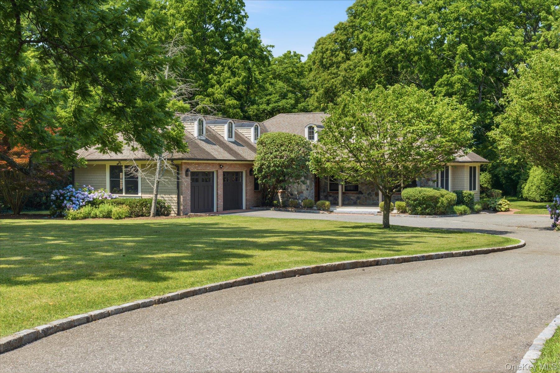 134 Sandy Hollow Road Northport, NY 11768 - Photo 1 of 28 Timeless custom residence set on 1.2 acres