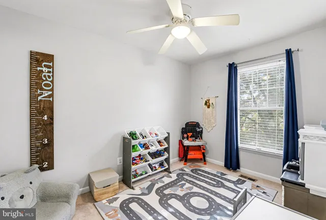 a bedroom with furniture and a book shelf