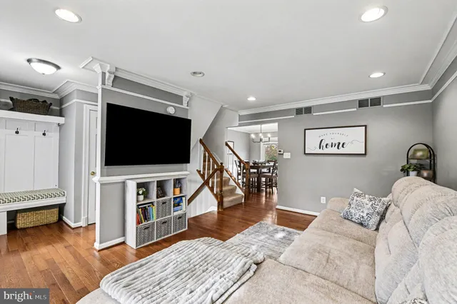 a view of a house with a yard and sitting area