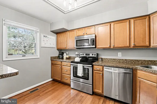 a bedroom with furniture and a flat screen tv