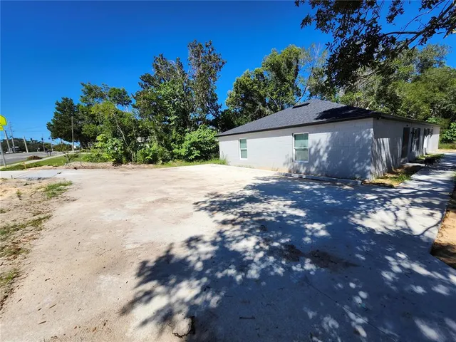 a house with trees in the background