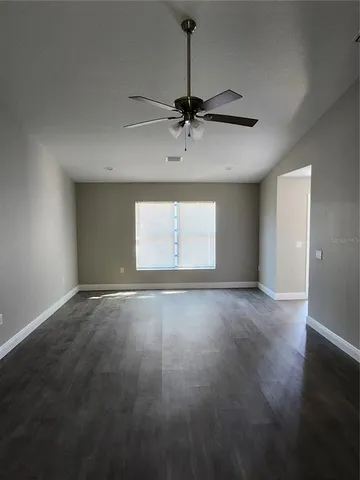 an empty room with a empty space and a window