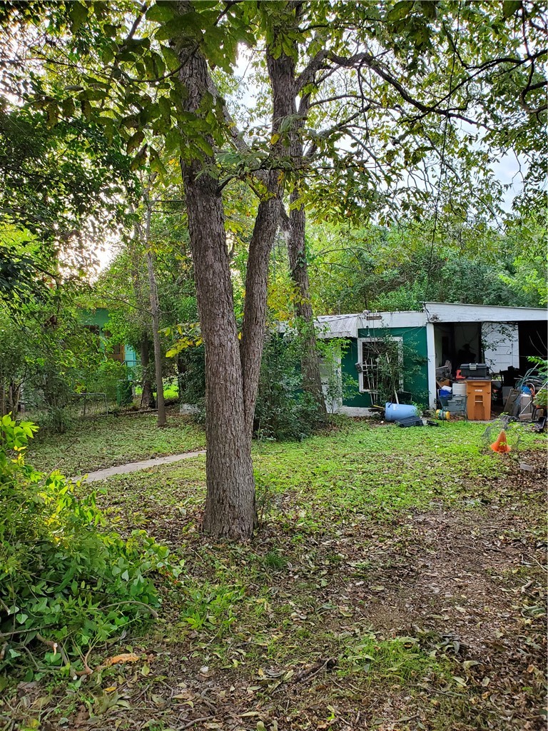 5512 Joe Sayers Avenue Austin, TX 78756 - Photo 12 of 19 a view of a house with backyard and garden