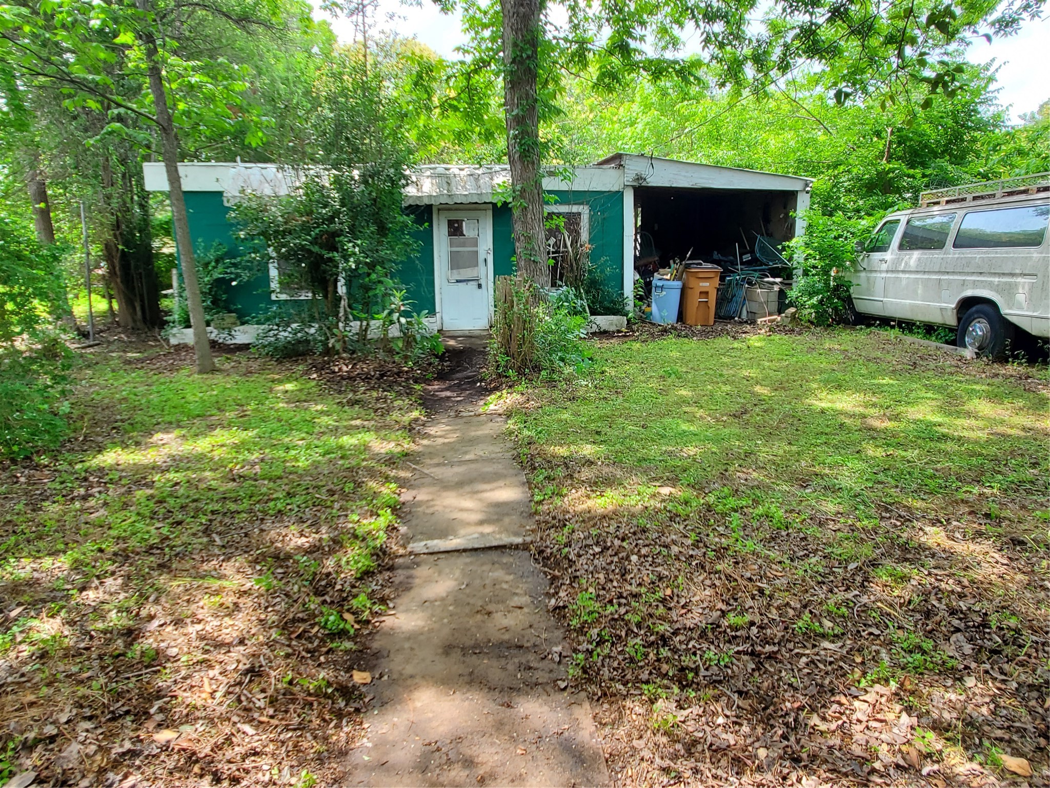 5512 Joe Sayers Avenue Austin, TX 78756 - Photo 5 of 19 a view of a house with backyard and a tree
