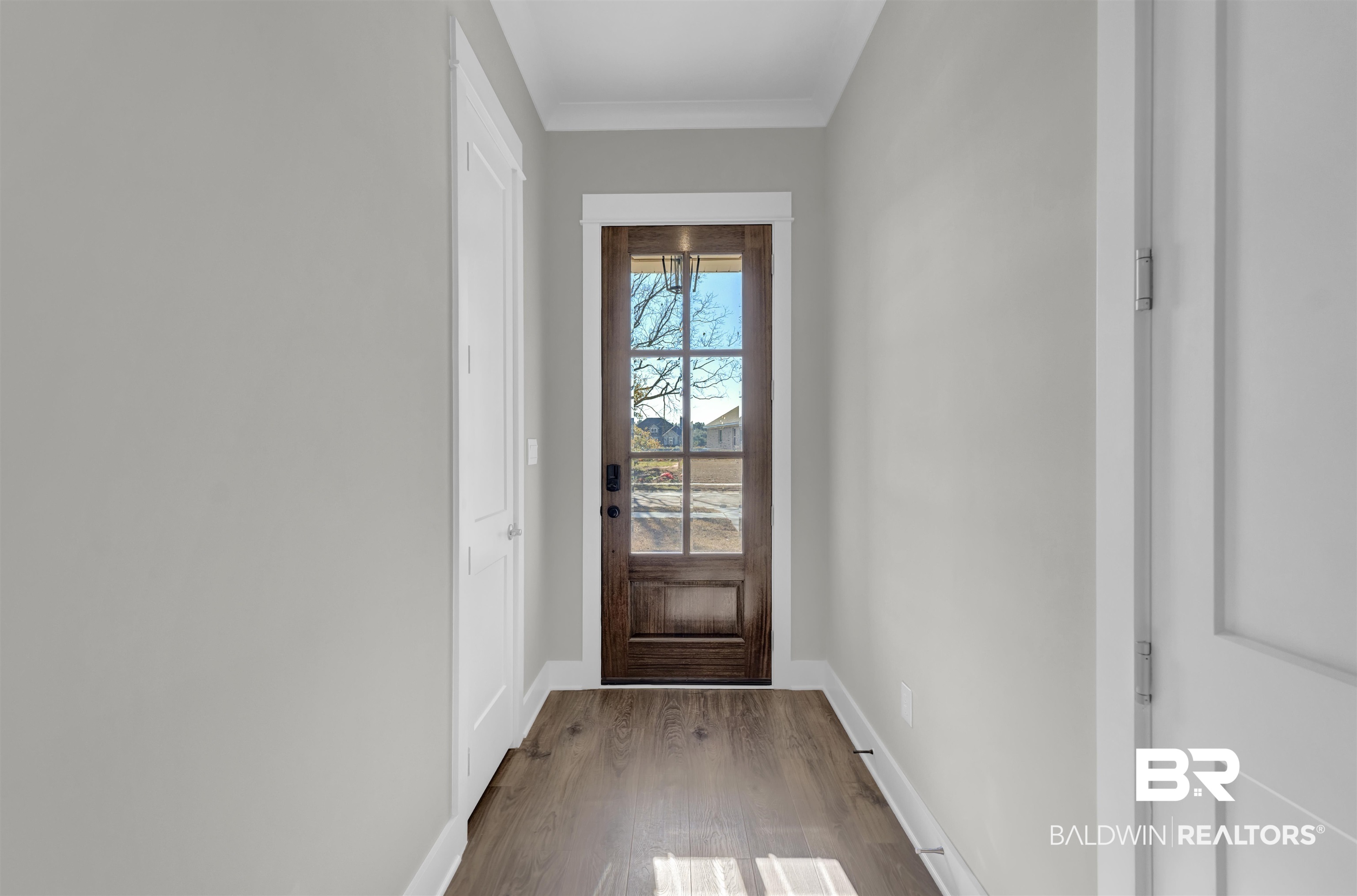 571 Morning Mist Way Fairhope, AL 36532 - Photo 3 of 47 Entryway with wood finished floors and ornamental molding