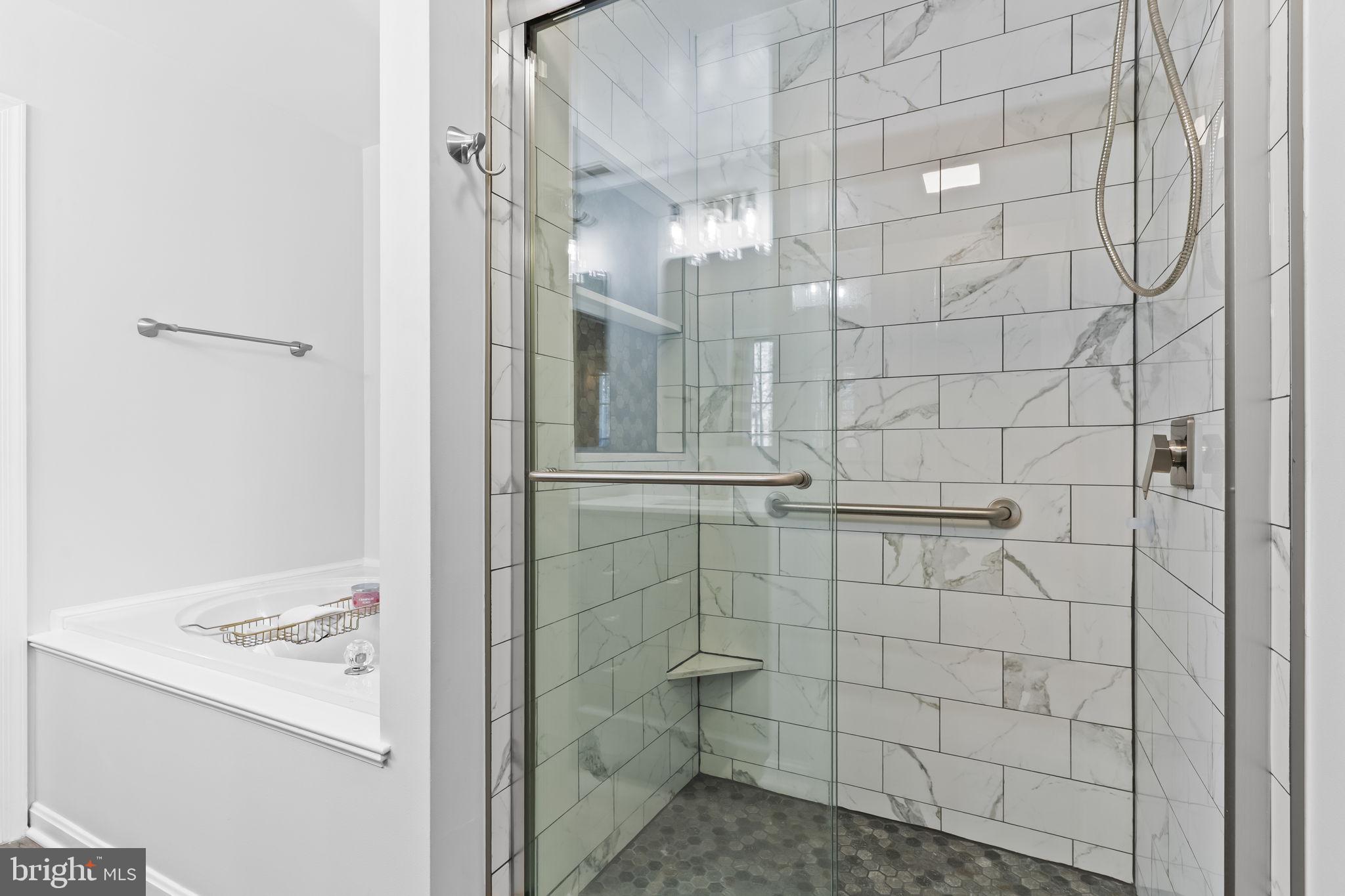 2132 Brians Way Lusby, MD 20657 - Photo 15 of 36 Sleek modern shower with elegant tiles.
