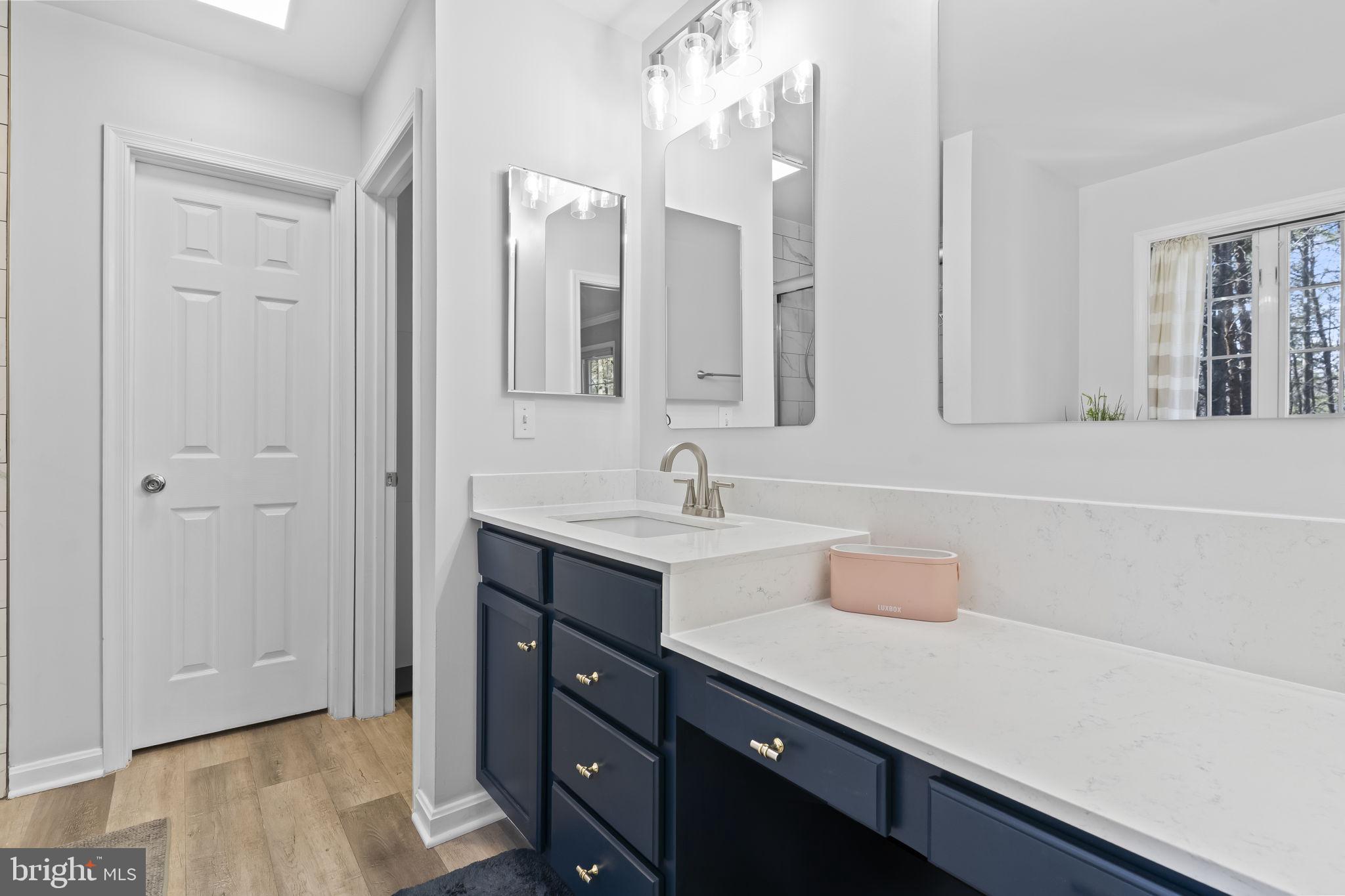 2132 Brians Way Lusby, MD 20657 - Photo 16 of 36 Sleek modern bathroom with natural light.