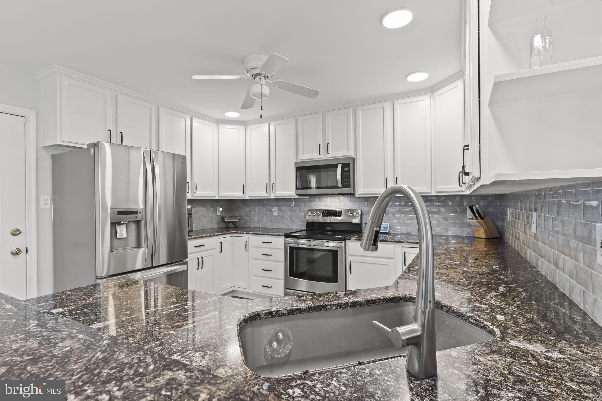 2132 Brians Way Lusby, MD 20657 - Photo 3 of 36 Modern kitchen with sleek finishes.