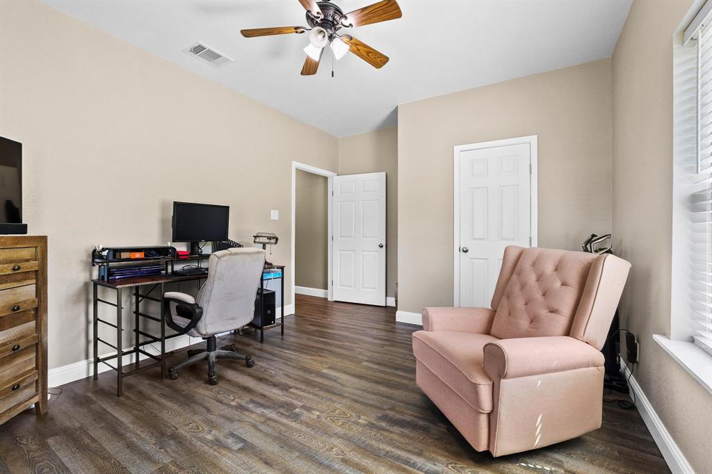 2658 Oak Ridge Road Denison, TX 75021 - Photo 22 of 37 a work room with furniture and wooden floor