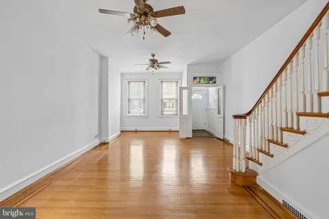 a view of an entryway with wooden floor