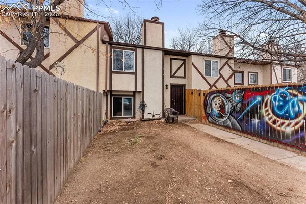 a view of a street with a tree in the house