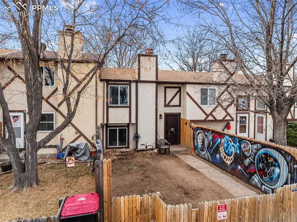 a view of multiple houses with cars