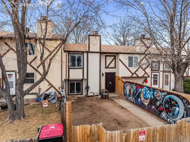 a view of multiple houses with cars